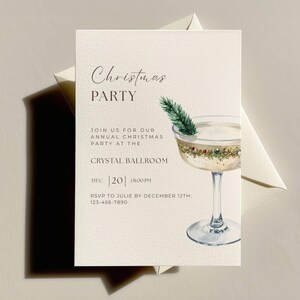 May include: Cream-colored Christmas party invitation with elegant script. Features a watercolor cocktail with a sprig of evergreen. Includes event details: "Christmas PARTY", "Crystal Ballroom", and RSVP information.