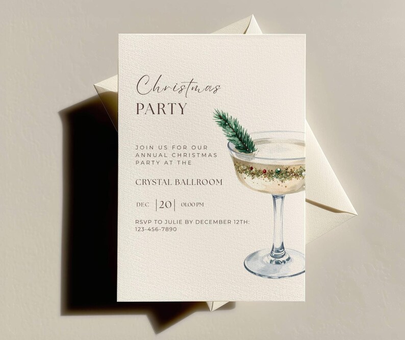 May include: Cream-colored Christmas party invitation with elegant script. Features a watercolor cocktail with a sprig of evergreen. Includes event details: "Christmas PARTY", "Crystal Ballroom", and RSVP information.