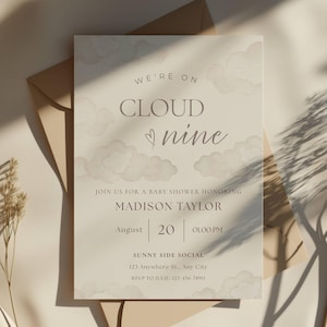 May include: A baby shower invitation with the text "WE'RE ON CLOUD nine" in a soft, neutral color palette. The invitation includes details for Madison Taylor's baby shower, with the date August 20th at 1:00 PM. The design features cloud illustrations.