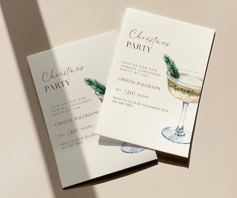 May include: Two cream-colored Christmas party invitations. The invitations feature the text "Christmas PARTY" and details for the event, including the date and time. A watercolor illustration of a cocktail glass with a sprig of greenery is also included.