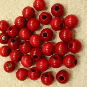 lot of  thirty-two 1" (25 mm) round red wooden  beads . . . . from the 1970's . . . excellent new condition