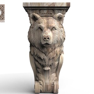 May include: A carved wooden bear head sculpture, part of a decorative architectural element. The bear's face is intricately detailed, with visible fur texture and a focused expression. The piece is light brown and appears to be made of wood.