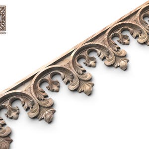 a decorative wooden trim with intricate floral designs.