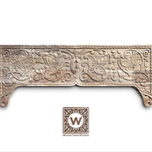 May include: A carved wooden decorative panel with an ornate floral design. The panel is light brown and features detailed carvings of leaves and vines. The bottom edges curve downward, and the panel has a rope-like border. The Wood Trim Studio logo is in the bottom centre.