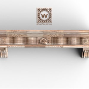 May include: A light-colored wooden mantelpiece with intricate carvings. The mantel features a central shell design, vertical grooves, and decorative spiral accents on each end. The text "Wood Trim Studio" is visible above the mantel.
