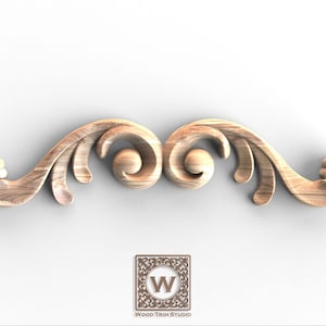May include: A wooden decorative scroll with a symmetrical design. The scroll features swirling patterns and rounded elements, with a light brown colour. The logo of Wood Trim Studio is at the bottom.