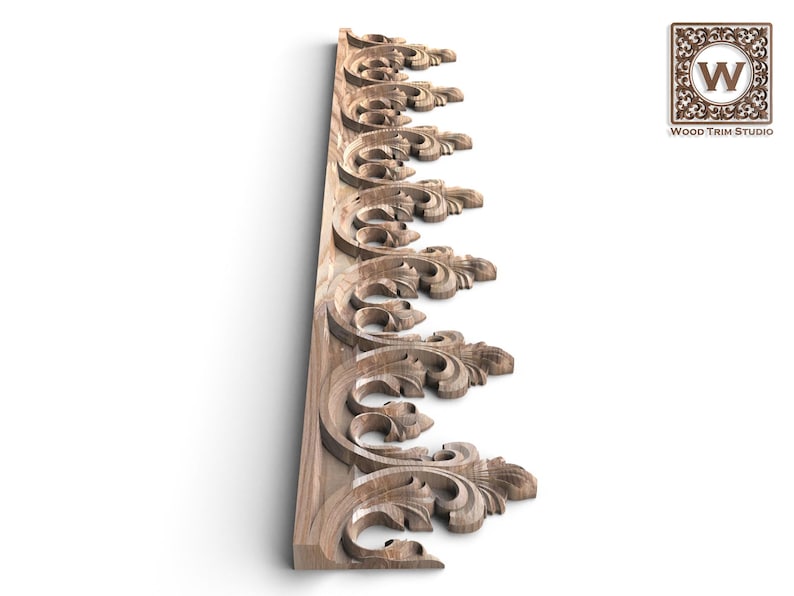 a decorative wooden panel with intricate scrollwork and floral patterns.
