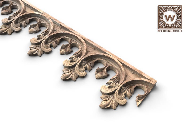 a decorative wooden piece with intricate carvings, including leaves and floral patterns, showcasing the craftsmanship and artistry of the piece.