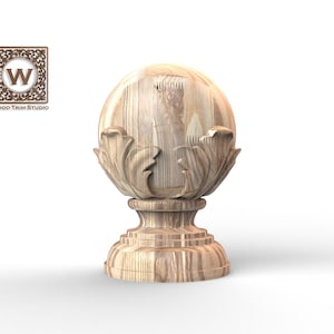 May include: A wooden finial with a carved floral design. The finial has a spherical top and a decorative base. The wood grain is visible. The logo for Wood Trim Studio is in the upper left corner.