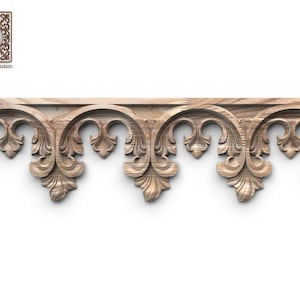 a decorative wooden border with intricate carved designs, including floral and scroll-like patterns.