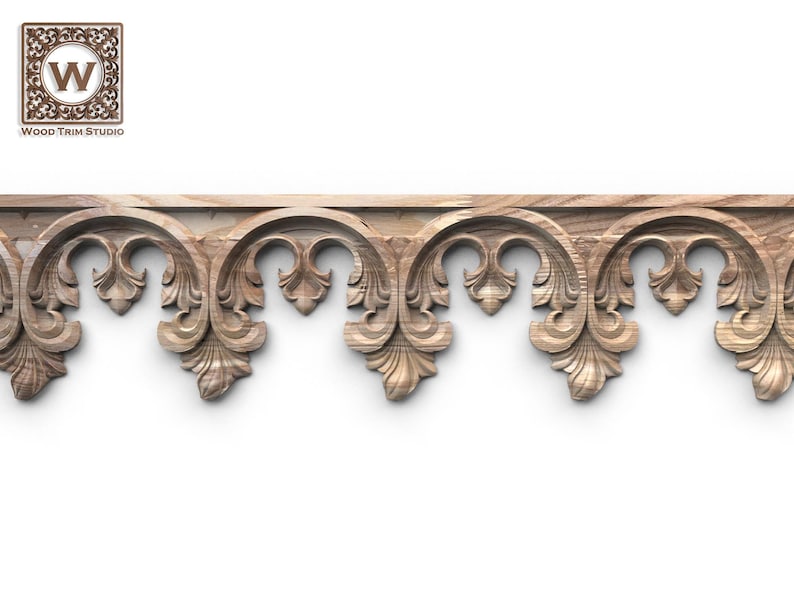 a decorative wooden border with intricate carved designs, including floral and scroll-like patterns.