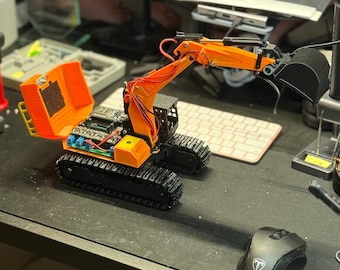 Excavadora teledirigida con control remoto Bluetooth: vehículo de construcción inteligente impreso en 3D.