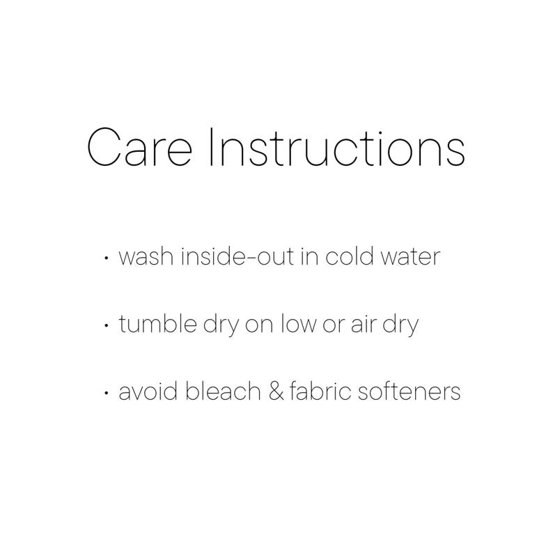 May include: White background with the text "Care Instructions". The instructions include washing inside-out in cold water, tumble drying on low or air drying, and avoiding bleach and fabric softeners.