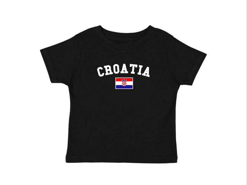 May include: Black t-shirt with the word "CROATIA" in white arched lettering above a small Croatian flag. The flag features a red, white, and blue design with a coat of arms.
