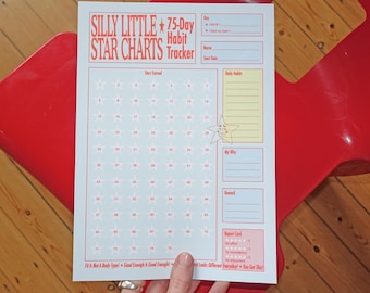May include: A white paper habit tracker sheet titled Silly Little Star Charts 75-Day Habit Tracker in red text. It features a grid of seventy-five numbered stars, sections for daily habits, a why statement, rewards, and a report card at the bottom.