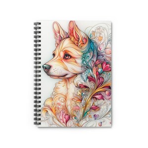 May include: Spiral-bound notebook featuring a colorful illustration of a dog's profile. The dog's fur is depicted in shades of orange, yellow, and white, with intricate floral patterns in pink, blue, and gold. The notebook has a white cover and a black spiral binding.