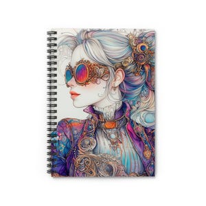 May include: Spiral-bound notebook featuring a watercolor illustration of a woman in steampunk attire. The woman wears ornate goggles with colorful lenses, a purple jacket, and a high-collared shirt. Her hair is styled with intricate details, and the overall aesthetic is fantasy-inspired.