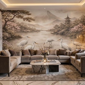 May include: A luxurious living room featuring a large sectional sofa in a neutral color, complemented by a marble coffee table and a scenic mural depicting a Japanese landscape with herons. The room has a modern design with a warm, inviting atmosphere.