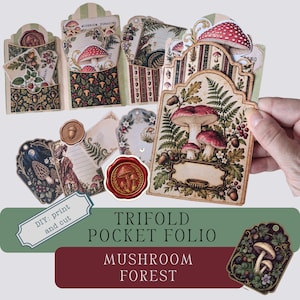 May include: A trifold pocket folio paper craft kit featuring mushroom and forest botanical illustrations. The set includes various die-cut tags, pockets, and cards with vintage-style designs, red wax seal motifs, and text reading DIY: print and cut.