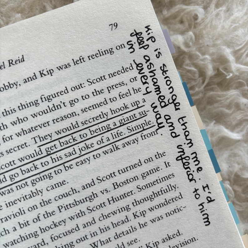 May include: Open book page with text and handwritten notes. The page number 79 is visible. Handwritten text includes phrases like "Kip is stronger than me" and "They would secretly hook up a".