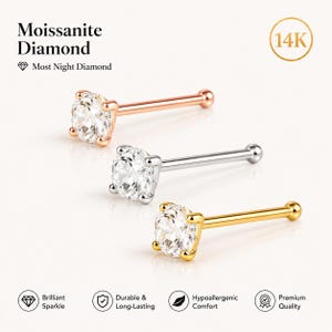 May include: Three nose studs with moissanite diamonds. One is rose gold, one is silver, and one is gold. The text reads "Moissanite Diamond" and "Most Night Diamond". The studs are labeled as "Brilliant Sparkle", "Durable & Long-Lasting", "Hypoallergenic Comfort", and "Premium Quality".