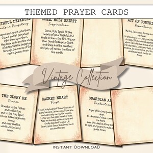 May include: A collection of themed prayer cards with vintage design elements. Each card features religious text and decorative borders. The cards are arranged in a display, with the words "Vintage Collection" displayed prominently.