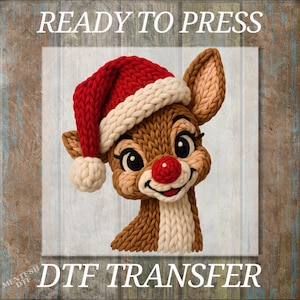 May include: A digitally rendered image of a reindeer wearing a Santa hat with the text "READY TO PRESS" at the top and "DTF TRANSFER" at the bottom. The reindeer has a red nose and is smiling.