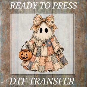 May include: A DTF transfer featuring a ghost wearing a large floral bow and a patchwork dress in muted tones. The ghost holds an orange jack-o'-lantern bucket and wears a small pumpkin pendant. The text READY TO PRESS DTF TRANSFER is visible.