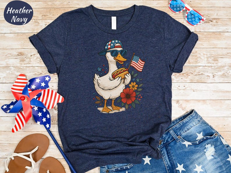 a t - shirt with a picture of a duck holding an american flag