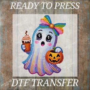 May include: A DTF transfer featuring a cartoon ghost with a rainbow bow, holding a pumpkin and a drink. The ghost has large eyes and a surprised expression. The words "READY TO PRESS" and "DTF TRANSFER" are printed above and below the image.