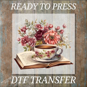 May include: DTF transfer design featuring a teacup and saucer with floral patterns, resting on an open book. A bouquet of red and white flowers is behind the teacup. The words "READY TO PRESS" and "DTF TRANSFER" are at the top and bottom.