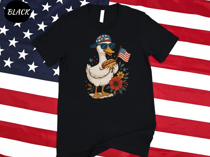 a black t - shirt with a picture of a duck holding an american flag