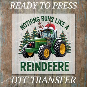 May include: A green John Deere tractor with a Santa hat and reindeer antlers, surrounded by Christmas trees. The text reads "Nothing Runs Like a Reindeer" and "Ready to Press".