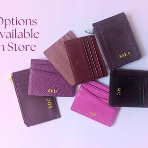 4 different card wallet options in purples and pinks - options available in store.