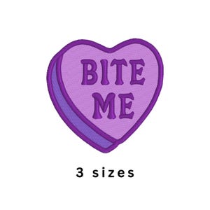May include: A heart-shaped embroidered patch in shades of purple featuring the text BITE ME in dark purple lettering. The design includes a dark purple border and a side panel detail. Below the heart, the text 3 sizes is clearly visible.