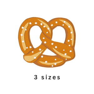 May include: An embroidered pretzel patch featuring golden-brown tones with lighter yellow highlights and small white stitched accents representing salt grains. The design is symmetrical with a knotted center and includes the text 3 sizes below.