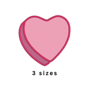 May include: A pink heart-shaped design with a darker pink outline and a textured fill. The text "3 sizes" is below the heart. This design is suitable for embroidery or crafting projects.