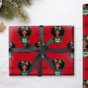 May include: Red wrapping paper with a black bow, featuring a repeating pattern of a woman with a bow and the text "merry bright." A matching roll of wrapping paper is also visible. The words "Love & passion" and "Melissa" are also visible.