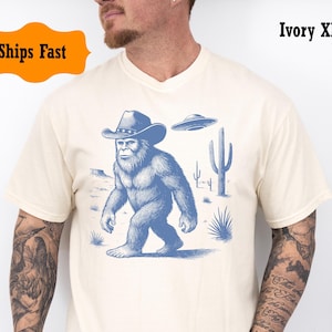 Vintage Bigfoot Men’s CowboyT-Shirt Funny Sasquatch Western Shirt with UFO Alien Graphic Comfort Colors Gift Cryptid Fans