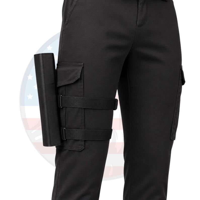 May include: Black cargo pants with a holster attached to the left leg. The holster is black and secured with adjustable straps. The pants have cargo pockets and a classic design.