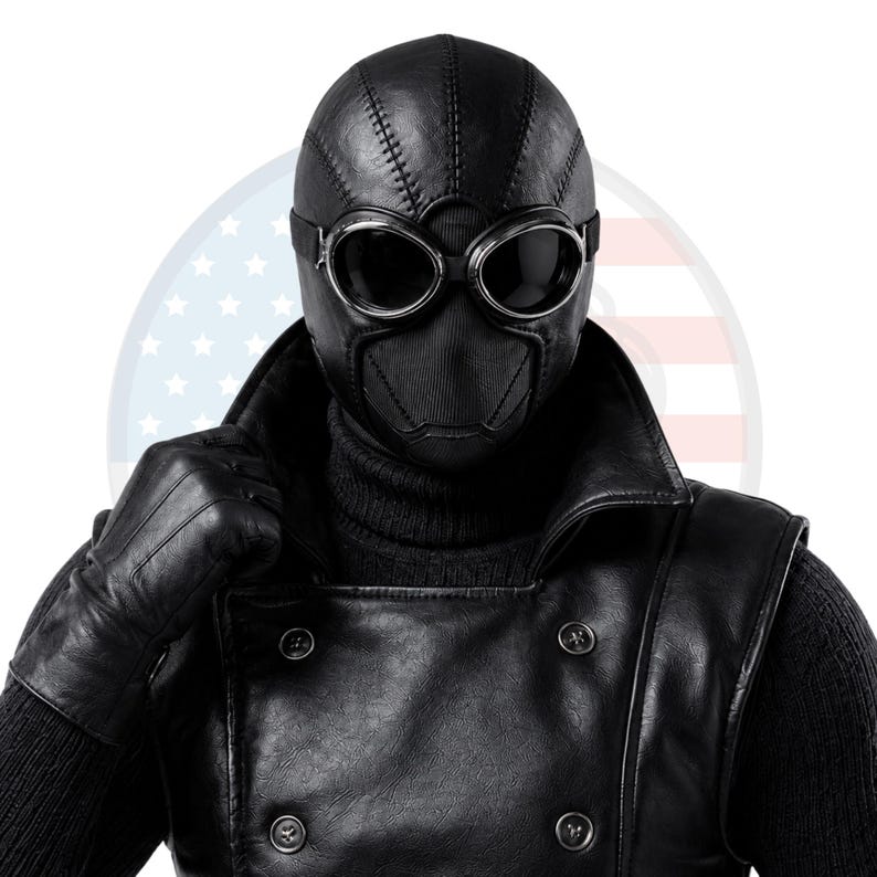 May include: A black full-head mask with visible stitched seams and integrated dark-tinted goggles featuring silver-toned rims. The mask is paired with a black double-breasted jacket with buttons and matching black leather gloves over a dark sweater.