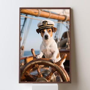 May include: A framed print featuring a Jack Russell Terrier wearing a captain's hat, standing behind a wooden ship's wheel. The dog is white and brown, with a focused expression. The background shows parts of a ship and the sky.