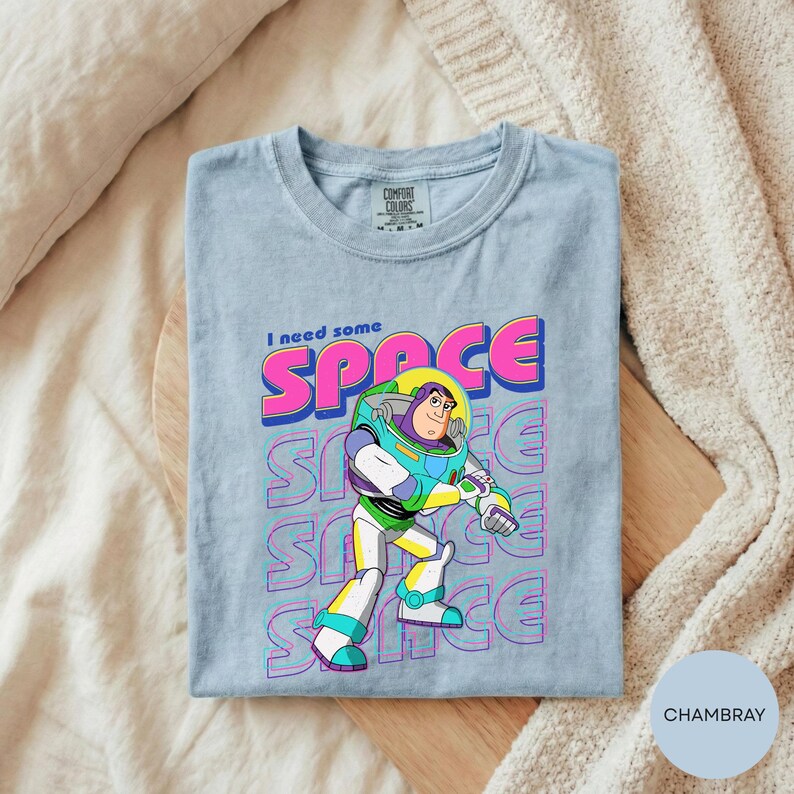 A gray t-shirt with a colorful graphic of a character from the Toy Story franchise, specifically Buzz Lightyear, printed on it.