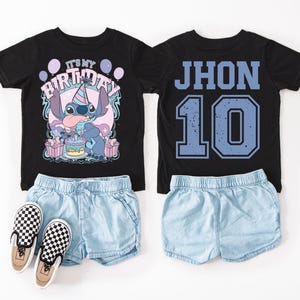 May include: Black t-shirts with matching denim shorts and checkered slip-on shoes. One shirt features Stitch with the text "IT'S MY BIRTHDAY". The other shirt has "JHON 10" in blue. A fun birthday outfit.