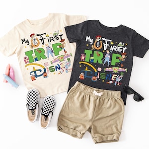 two children's clothing items are laid out on a white surface
