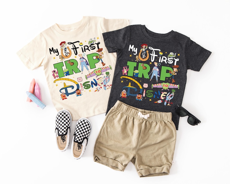 two children's clothing items are laid out on a white surface