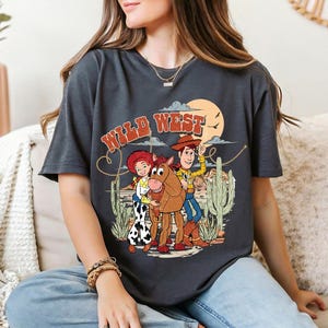 a woman sitting on a couch wearing a t - shirt