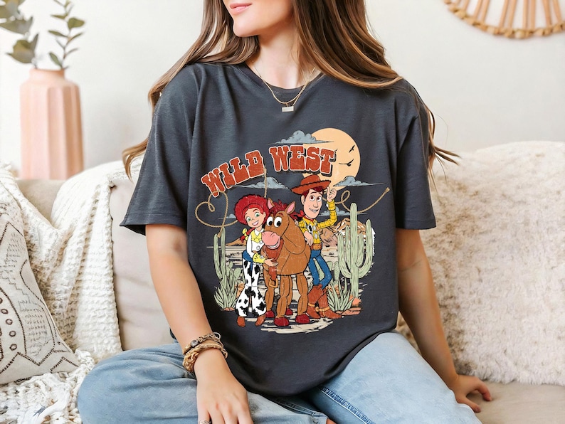 a woman sitting on a couch wearing a t - shirt