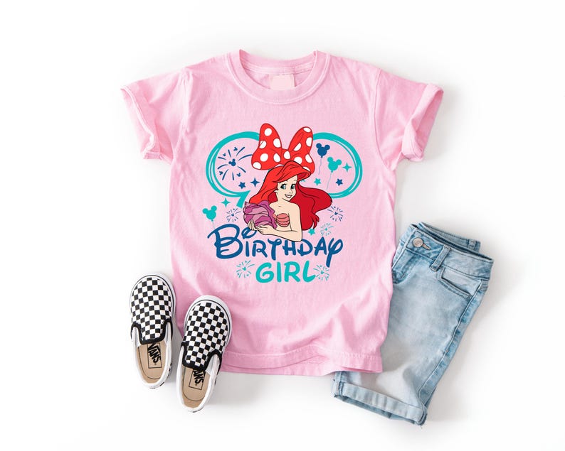 a pink shirt with a cartoon character on it