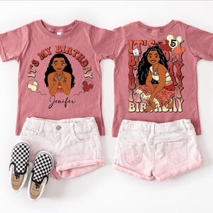 May include: Two matching mauve t-shirts featuring a cartoon character graphic and the text "It's My Birthday". They are styled with white shorts and black and white checkered trainers. One shirt has the name "Jenifer".